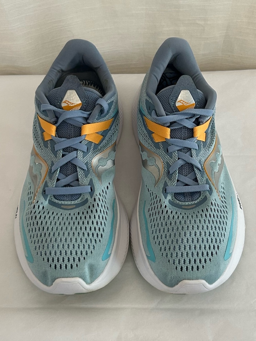 Saucony Ride 15 Women's Light Blue Athletic Sneakers with Yellow Accents